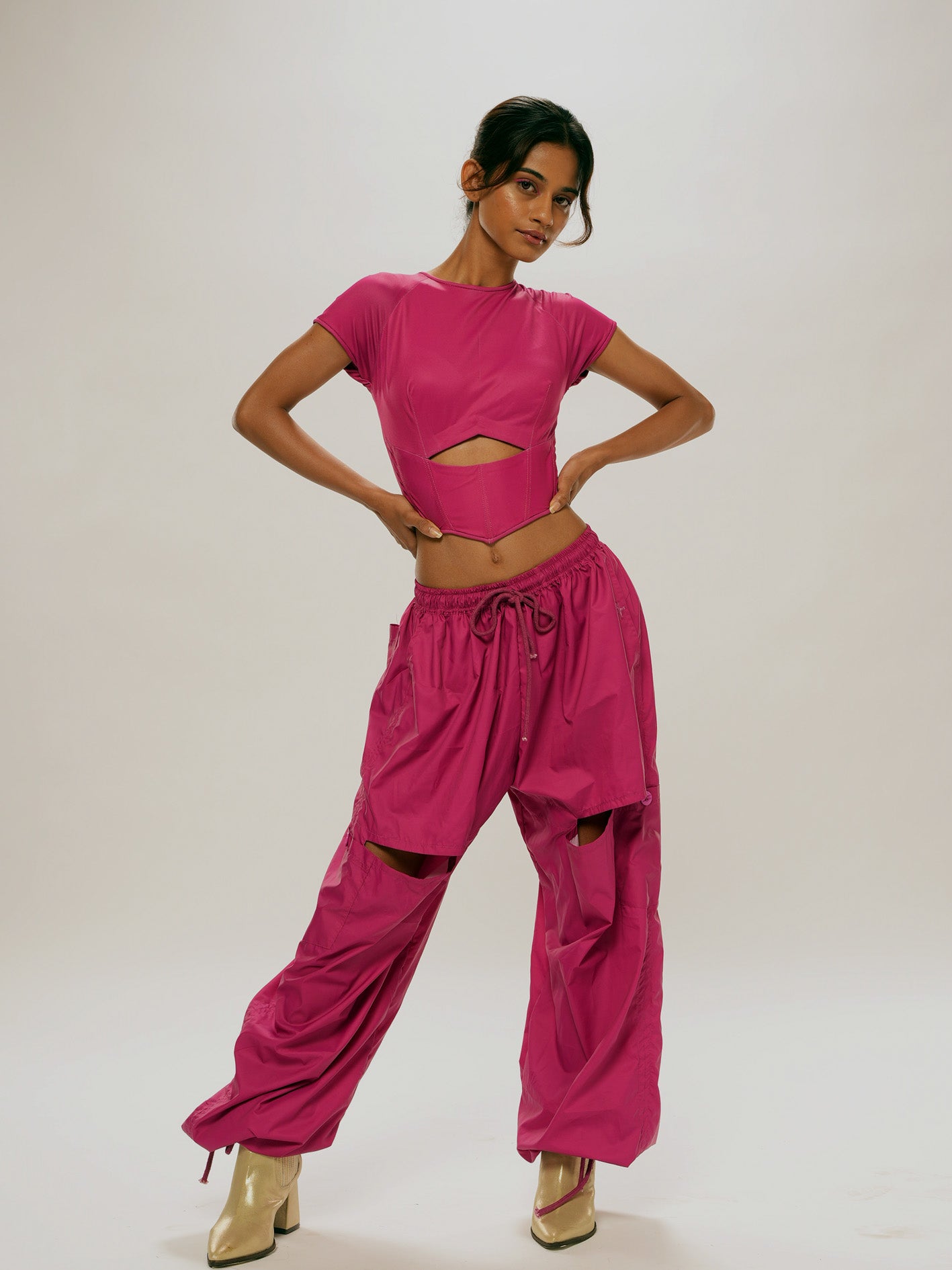 Magenta cut- out parachute trousers