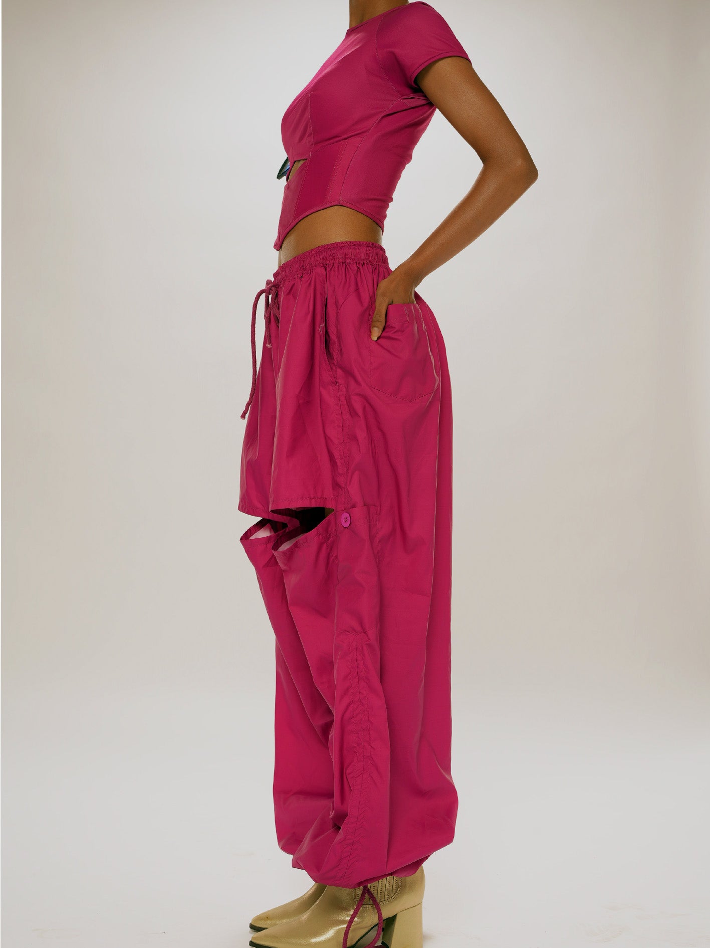 Magenta cut- out parachute trousers